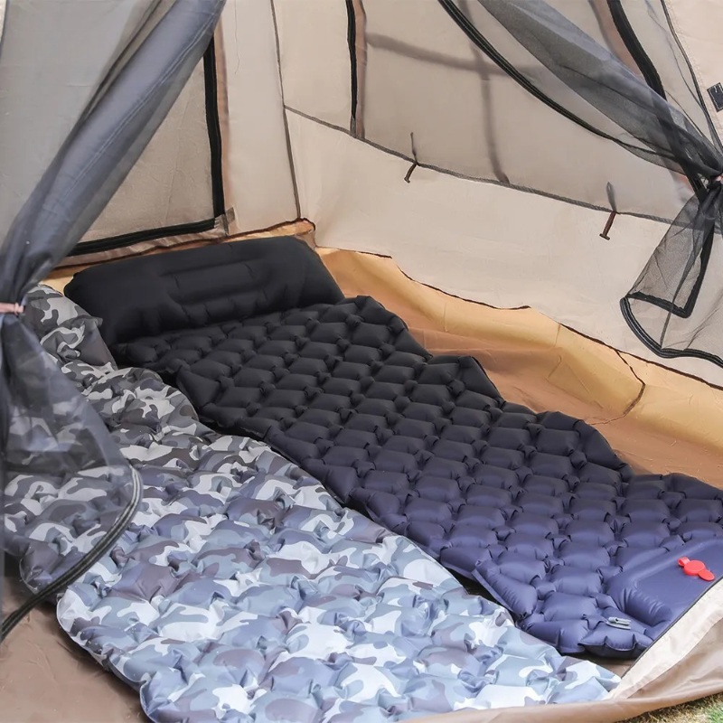 Camping mattress with camouflage pattern inside a tent