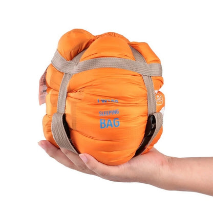 680g ultralight sleeping bag in army green compressed, held in one hand