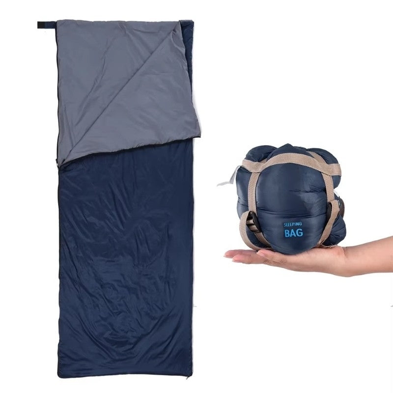 Ultralight sleeping bag in navy blue shown open and compressed side by side