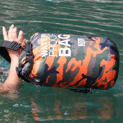 Camouflage waterproof bag being tested in water