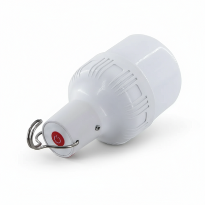 White light bulb-shaped device with a red button on a white background