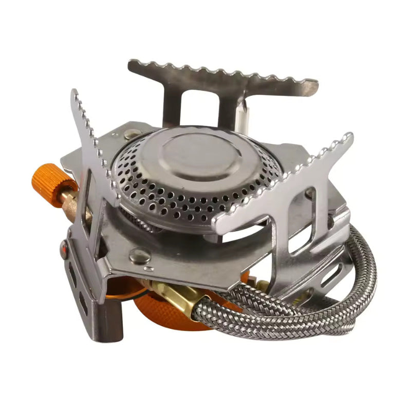 Compact portable camping stove with foldable pot supports, metal burner head, and braided fuel hose.