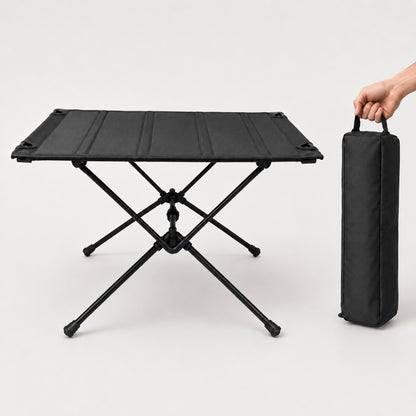 750g folding camping table in black with X-frame and carry bag, studio shot